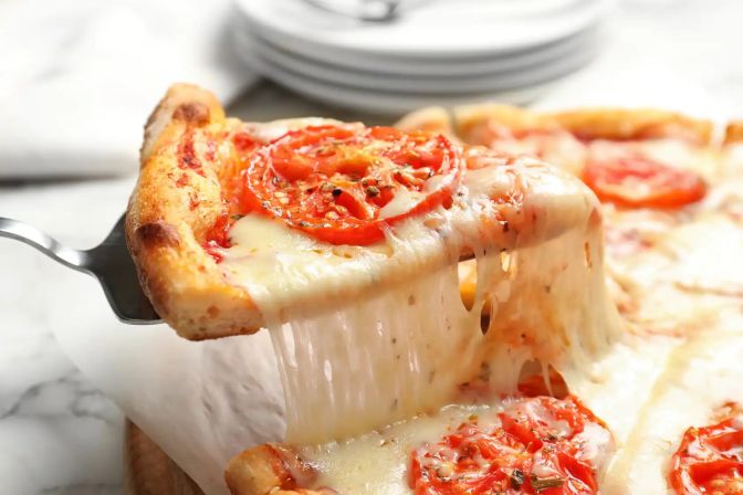 Extra cheesy pizza slice