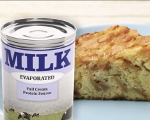 Full cream milk powder high heat can next to a baked item