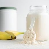 Bananas and milk next to whey powder
